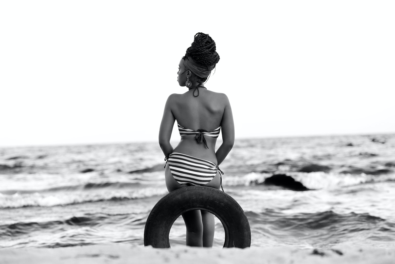 Photo of Woman Sitting On Tire