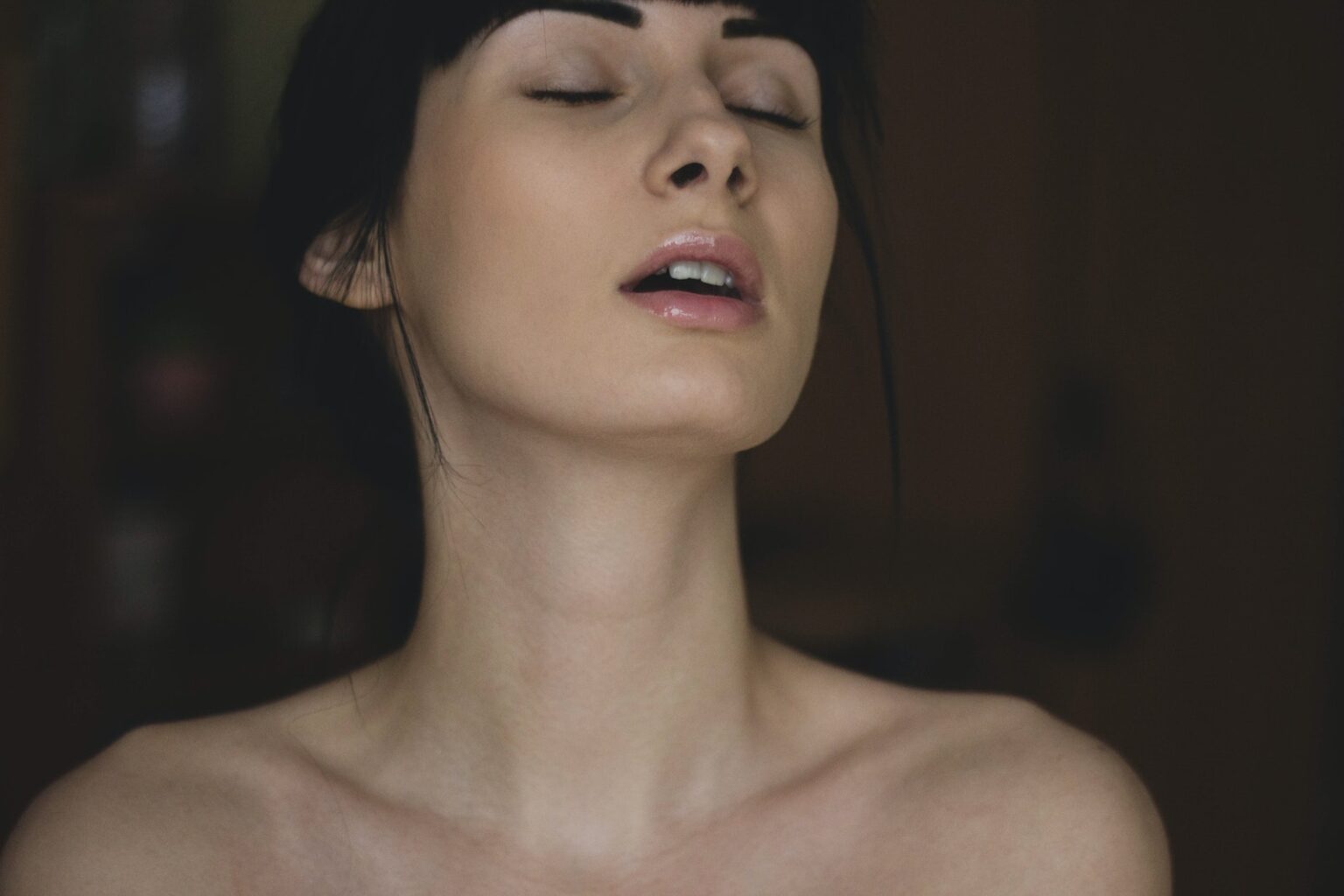 Topless Woman Closing Her Eyes