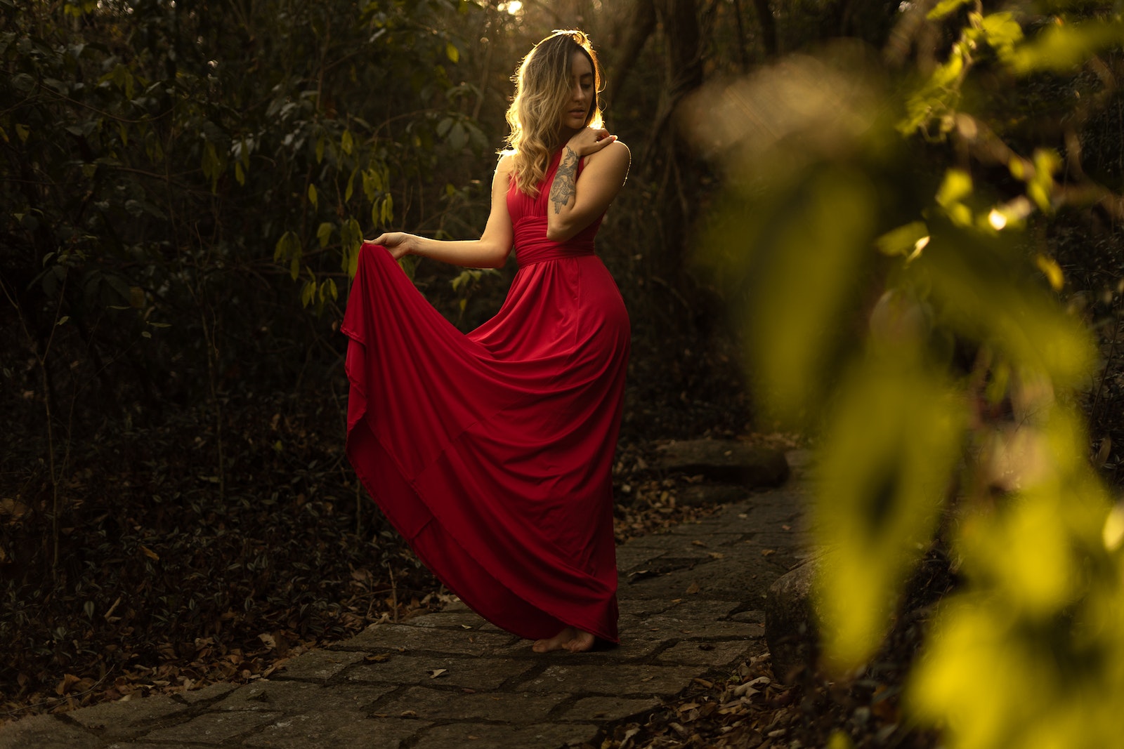 Photo of Woman Wearing Red Dress