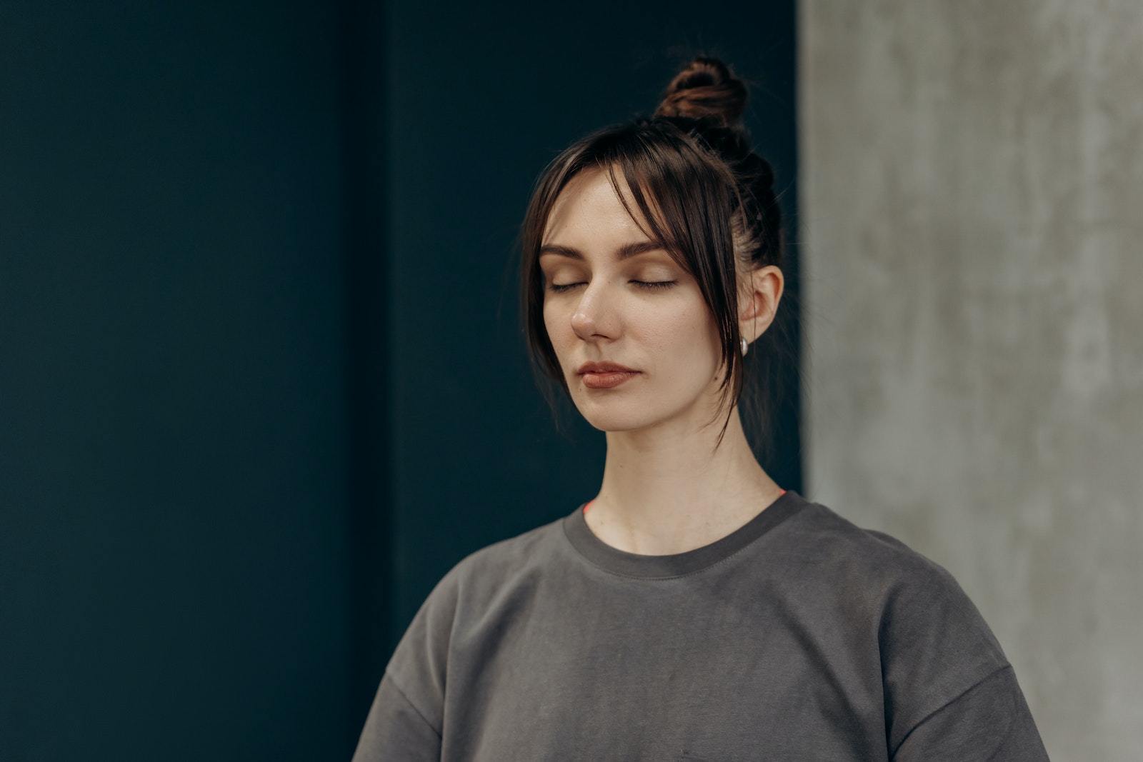 Woman in Gray Crew Neck Shirt With Closed Eyes