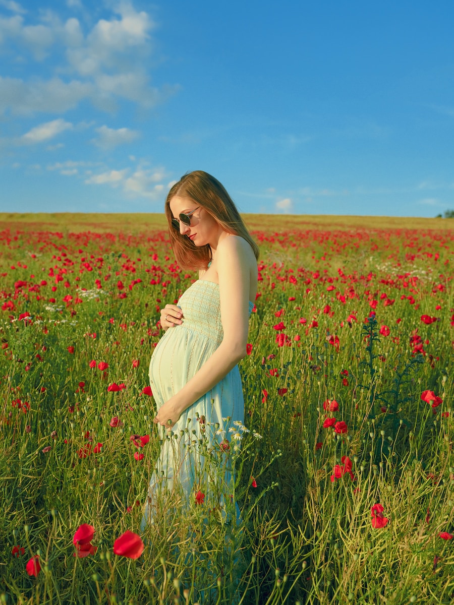 a person standing in a field of flowers