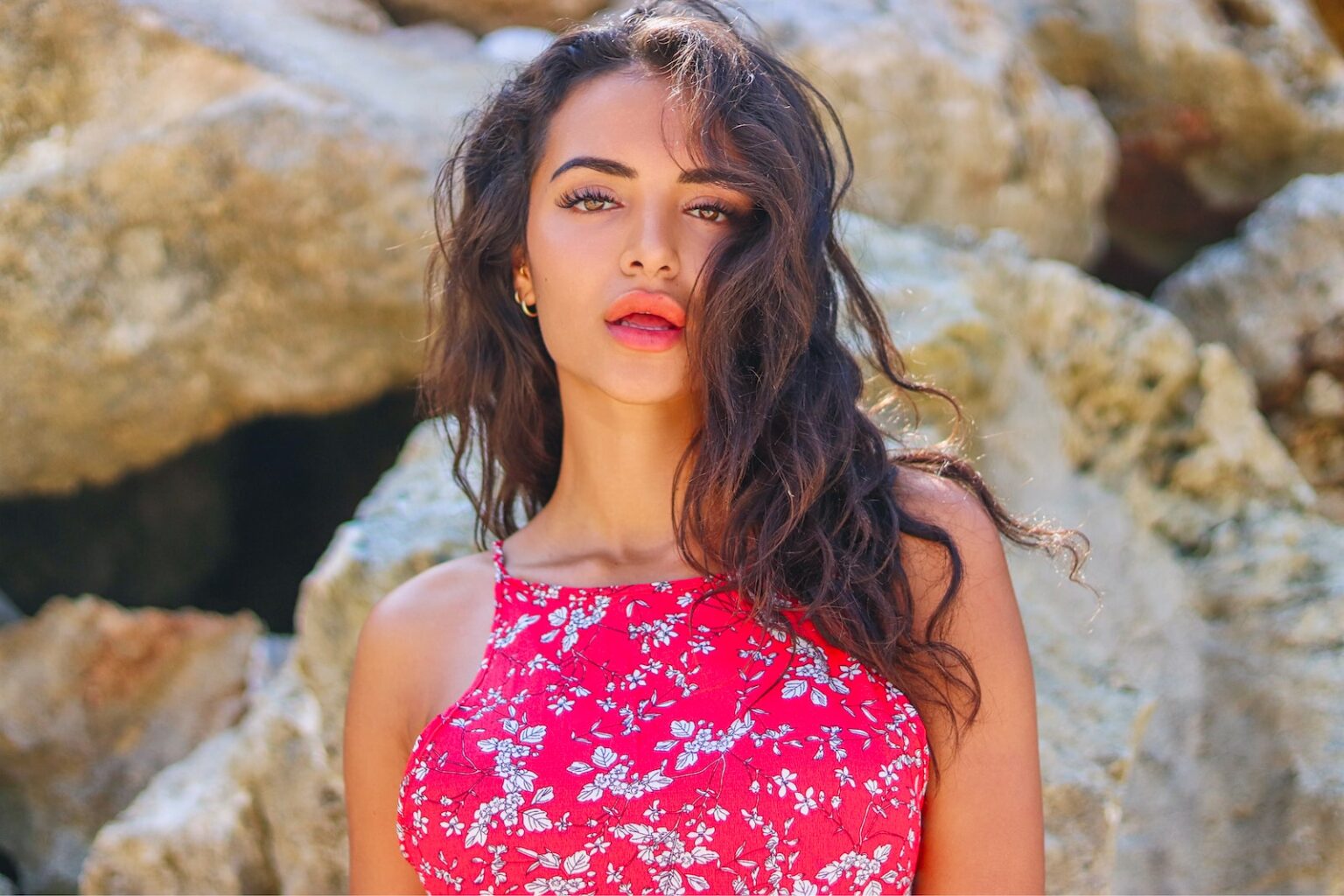 woman in red and white floral spaghetti strap top